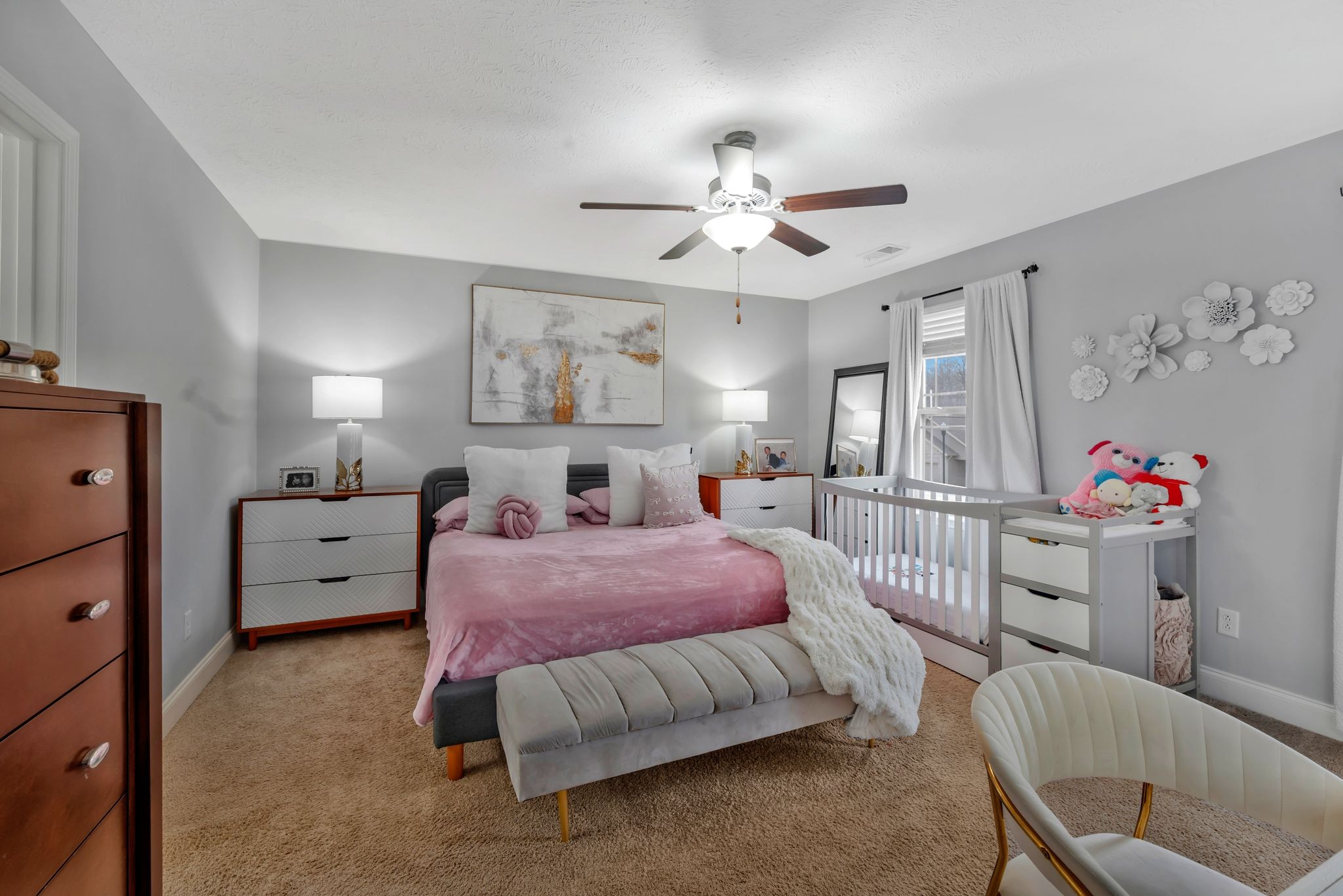 1043 Berra Drive Springfield, TN 37172 - Photo 26 of 33 a spacious bedroom with a bed and a chandelier