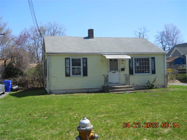 39 Bernard Street Springfield, MA 01109 - Photo 1 of 5 a front view of house with yard and outdoor seating