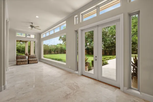 a kitchen with refrigerator and cabinets