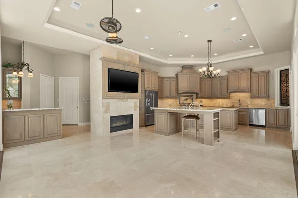 a kitchen with a stove and a large window