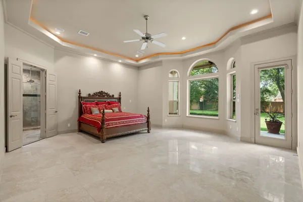 a large bathroom with a granite countertop double vanity and a mirror