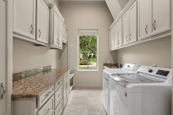 a kitchen with stainless steel appliances granite countertop a stove and a sink