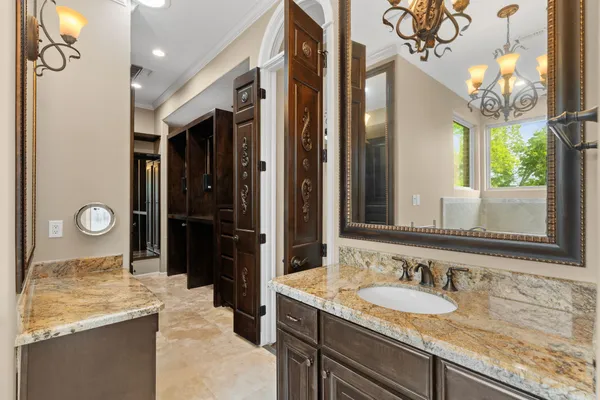 a view of a room with gym equipment and wooden floor