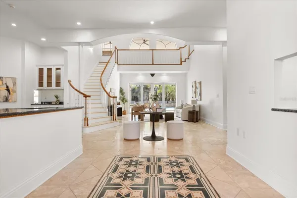 a kitchen with stainless steel appliances a stove refrigerator sink and microwave