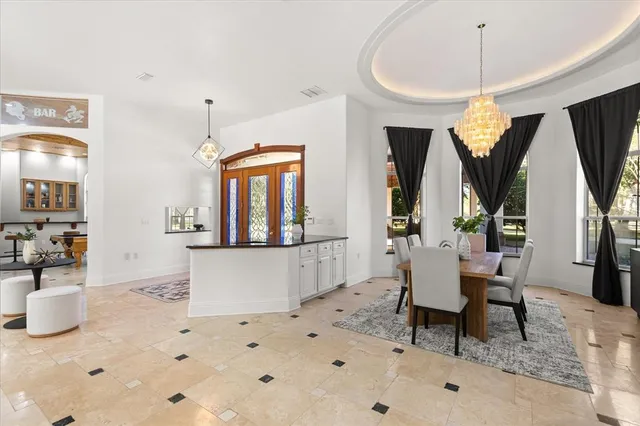 a kitchen with stainless steel appliances kitchen island granite countertop a sink and cabinets