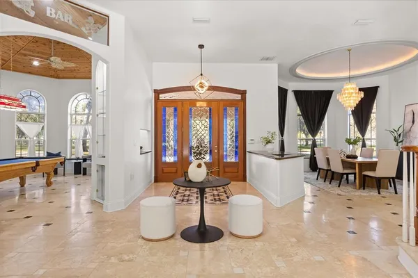 a kitchen with stainless steel appliances kitchen island granite countertop a sink and cabinets