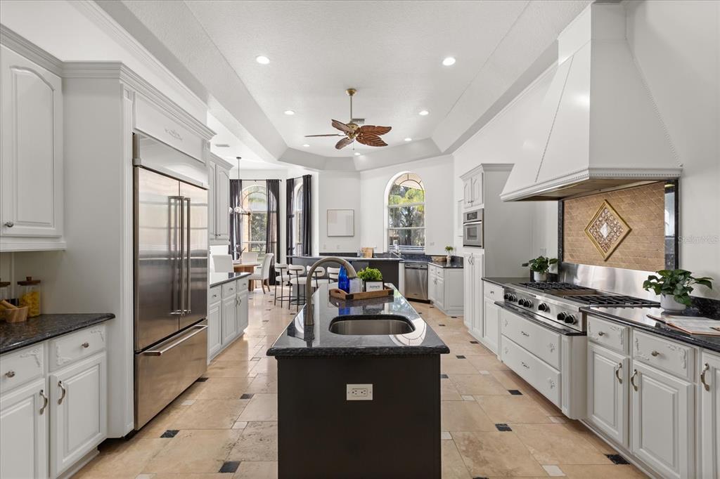 1501 Lake Markham Road Sanford, FL 32771 - Photo 24 of 93 a kitchen with counter top space a sink stainless steel appliances and cabinets