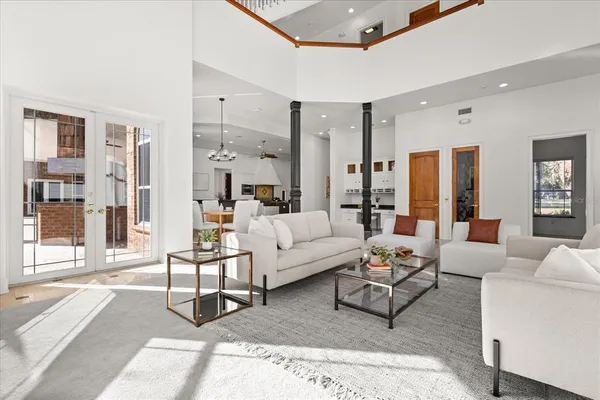 a large bathroom with a granite countertop tub a sink and a large mirror