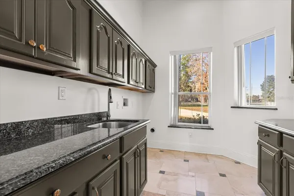 a view of a kitchen with furniture and a fireplace