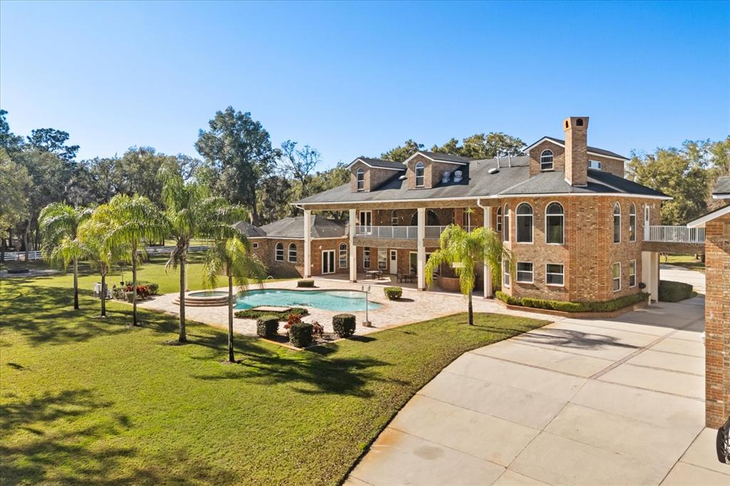 1501 Lake Markham Road Sanford, FL 32771 - Photo 6 of 93 a view of a house with swimming pool and sitting area