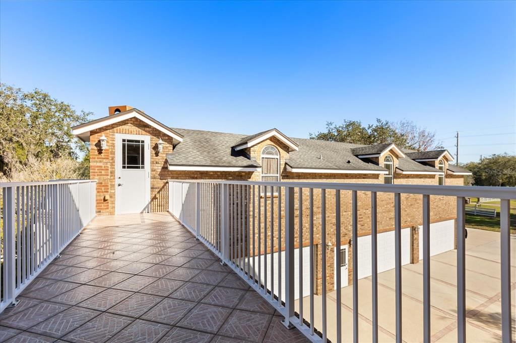 1501 Lake Markham Road Sanford, FL 32771 - Photo 81 of 93 a view of a brick house with wooden fence