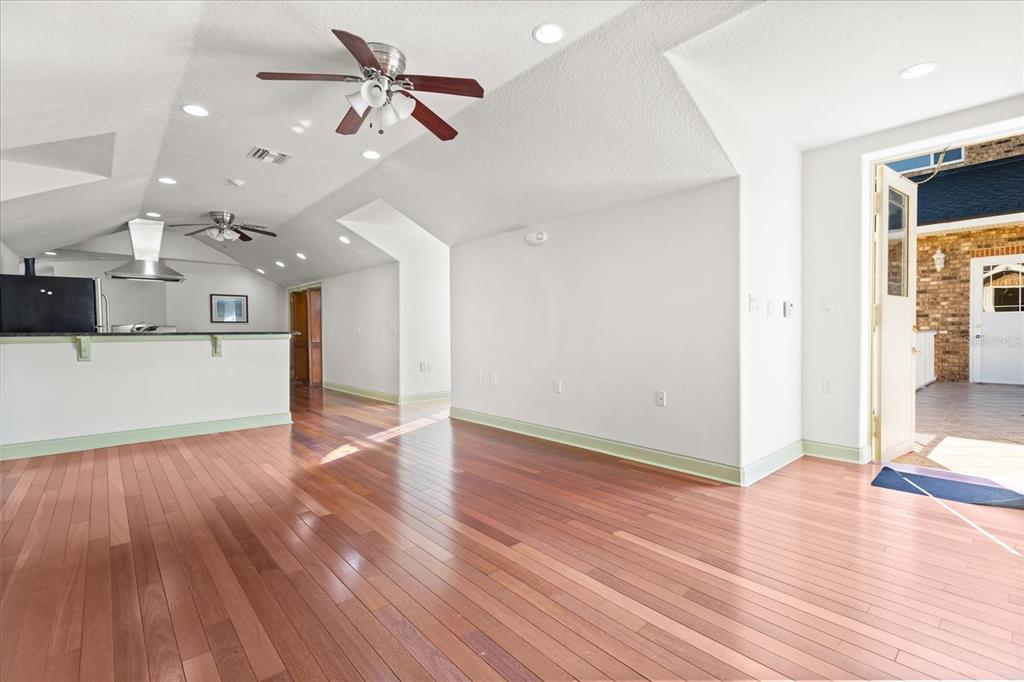 1501 Lake Markham Road Sanford, FL 32771 - Photo 83 of 93 a view of a kitchen with a ceiling fan and wooden floor