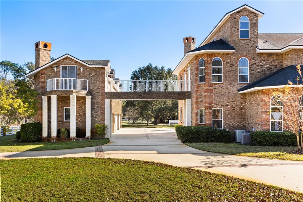 1501 Lake Markham Road Sanford, FL 32771 - Photo 10 of 93 a front view of a house with a yard