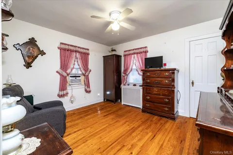 a room with furniture and a ceiling fan