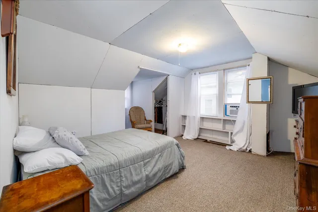 a bedroom with bed and window