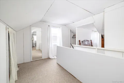 a view of a big room with closet and wooden floor