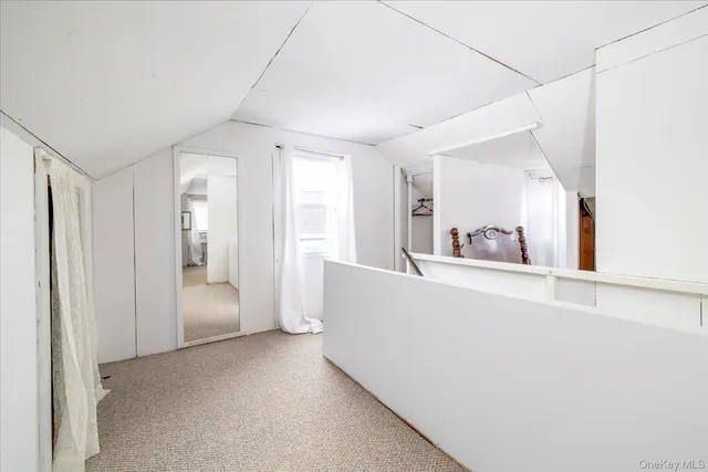 a view of a big room with closet and wooden floor