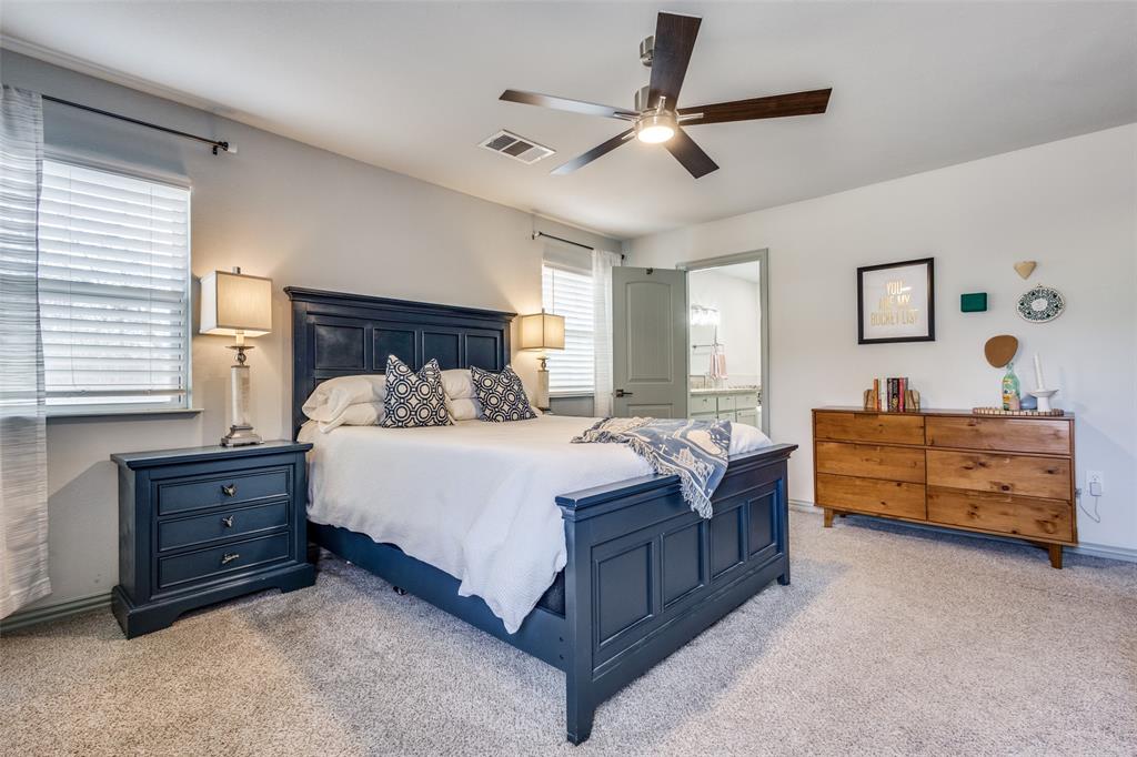 409 West Johnson Street Denison, TX 75020 - Photo 16 of 25 a bed room with a bed and a dresser
