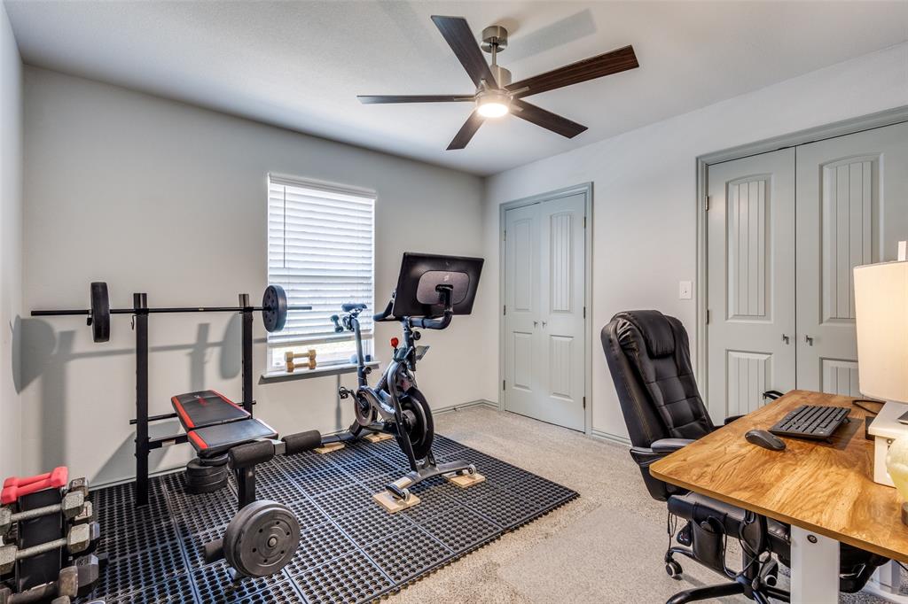 409 West Johnson Street Denison, TX 75020 - Photo 21 of 25 a work room with furniture and a window