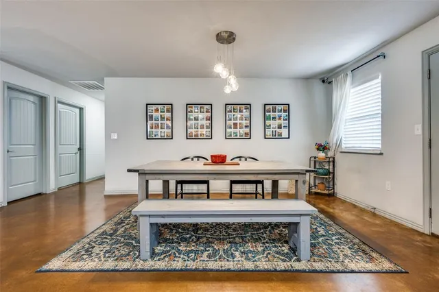 a view of a living room and dining area