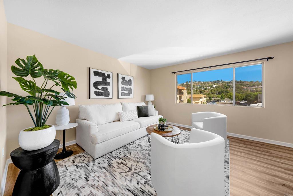 6775 Alvarado Road, Unit 7 San Diego, CA 92120 - Photo 2 of 24 a living room with furniture and a potted plant