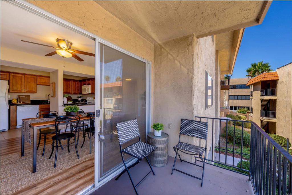 6775 Alvarado Road, Unit 7 San Diego, CA 92120 - Photo 22 of 24 a view of a patio with a dining table and chairs and potted plants