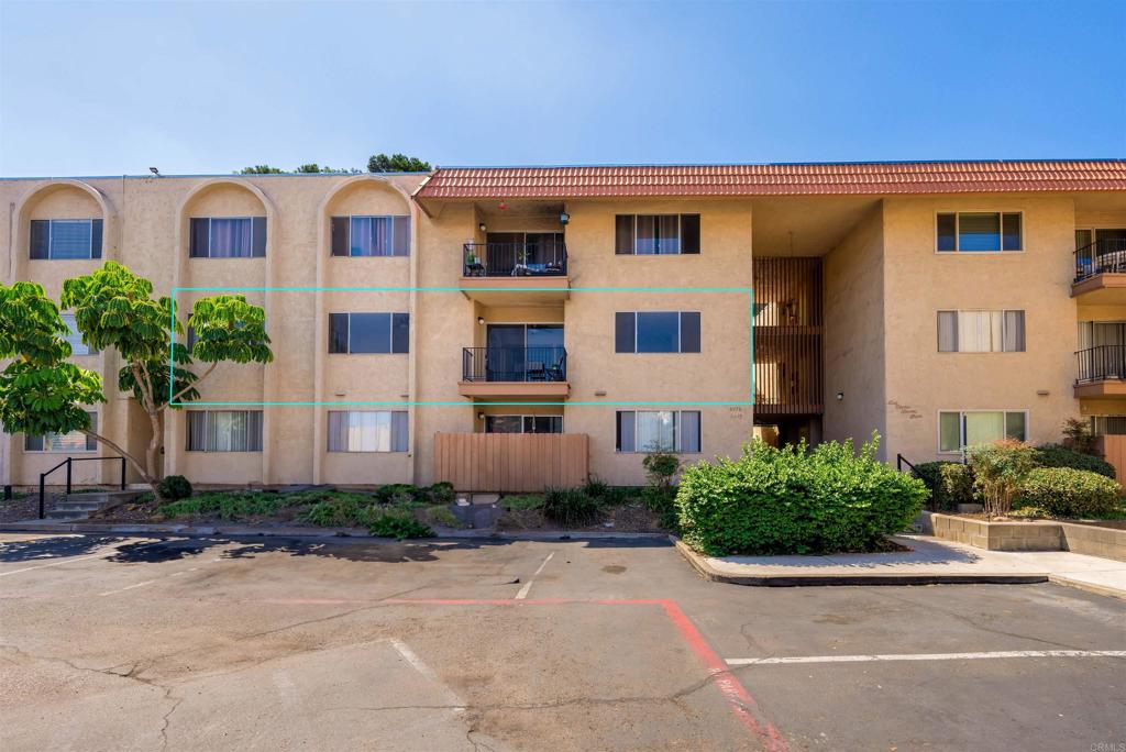 6775 Alvarado Road, Unit 7 San Diego, CA 92120 - Photo 24 of 24 a front view of a house with a yard and garage