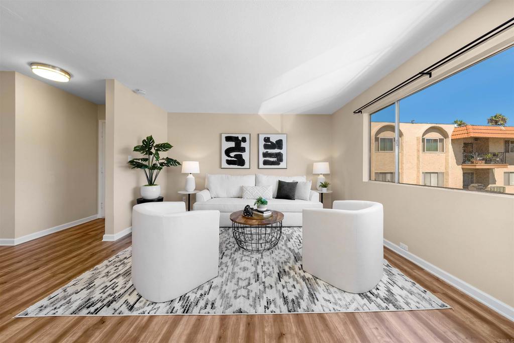 6775 Alvarado Road, Unit 7 San Diego, CA 92120 - Photo 3 of 24 a living room with furniture and a table