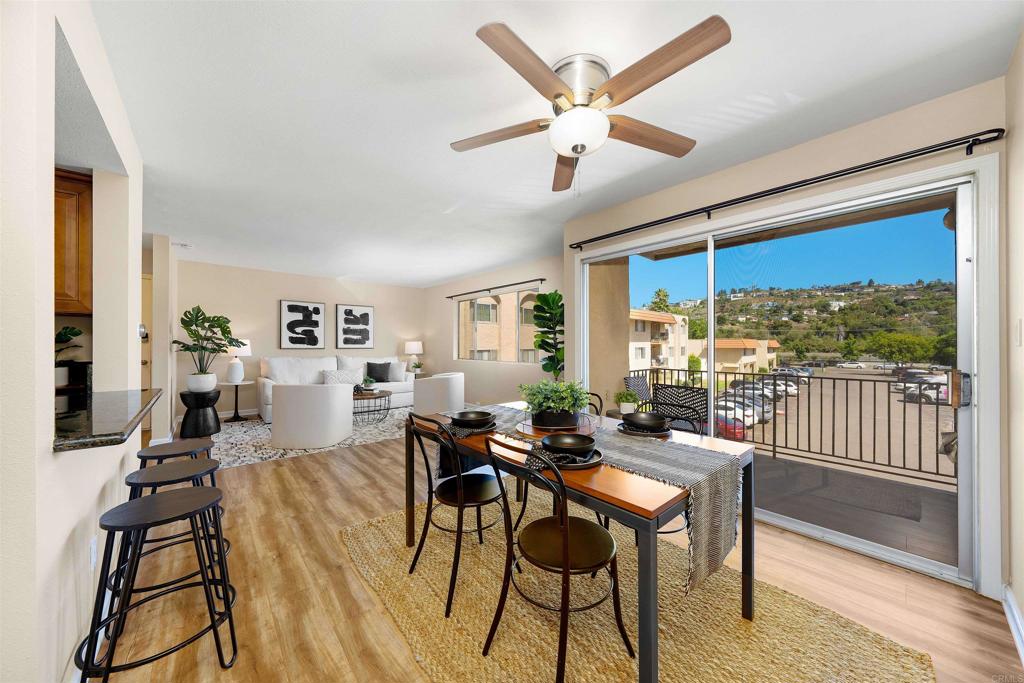 6775 Alvarado Road, Unit 7 San Diego, CA 92120 - Photo 6 of 24 a view of a dining room with furniture window and wooden floor