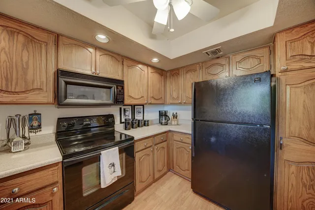 a kitchen with a refrigerator stove and sink