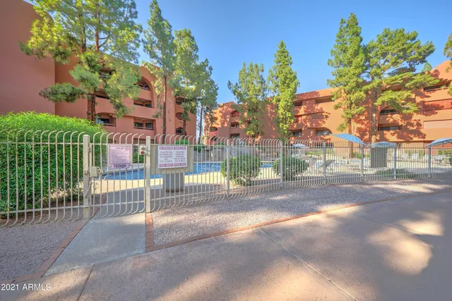 a view of a street with a building in the background