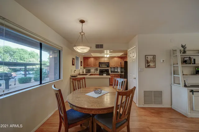 a view of a dining room with furniture window and wooden floor