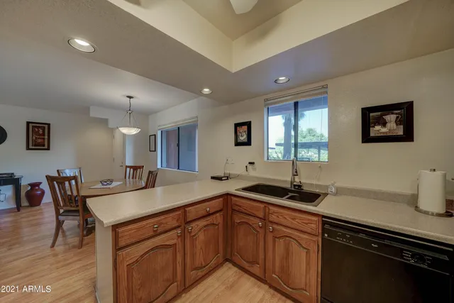 a kitchen with a sink and cabinets