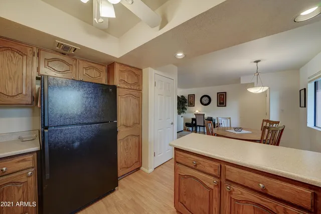 a kitchen with a refrigerator and a sink