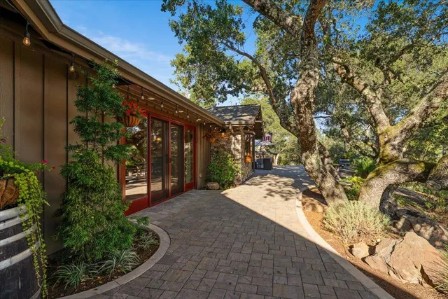 a kitchen that has a lot of cabinets in it and wooden floors