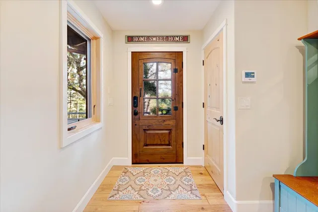 a living room with a fireplace and a flat screen tv
