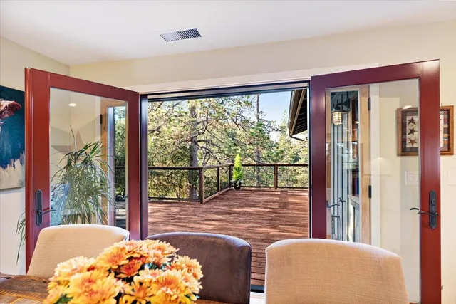 a bedroom with a bed and painting on the wall