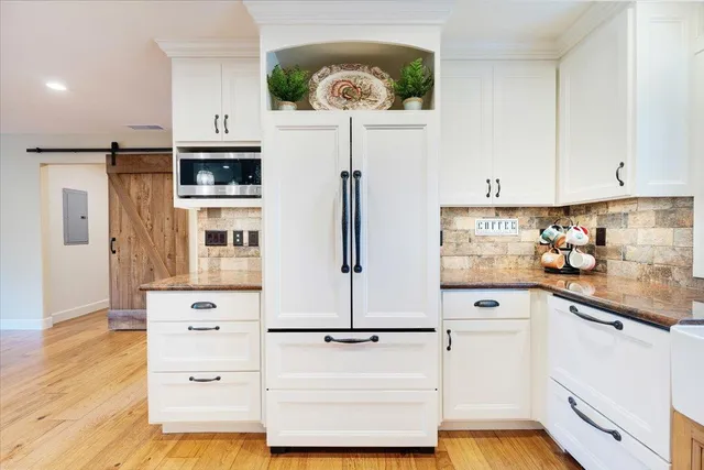 a bedroom with a bed and a couch