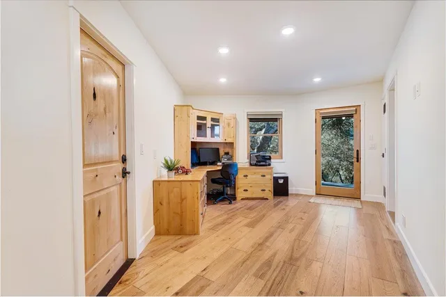 a bedroom with a bed and cabinets