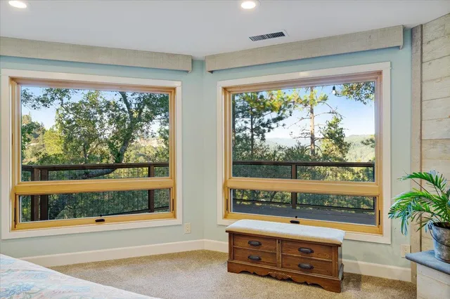 a view of a balcony with wooden floor