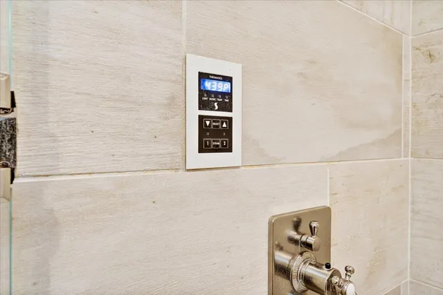a aerial view of a house with a yard and a large tree