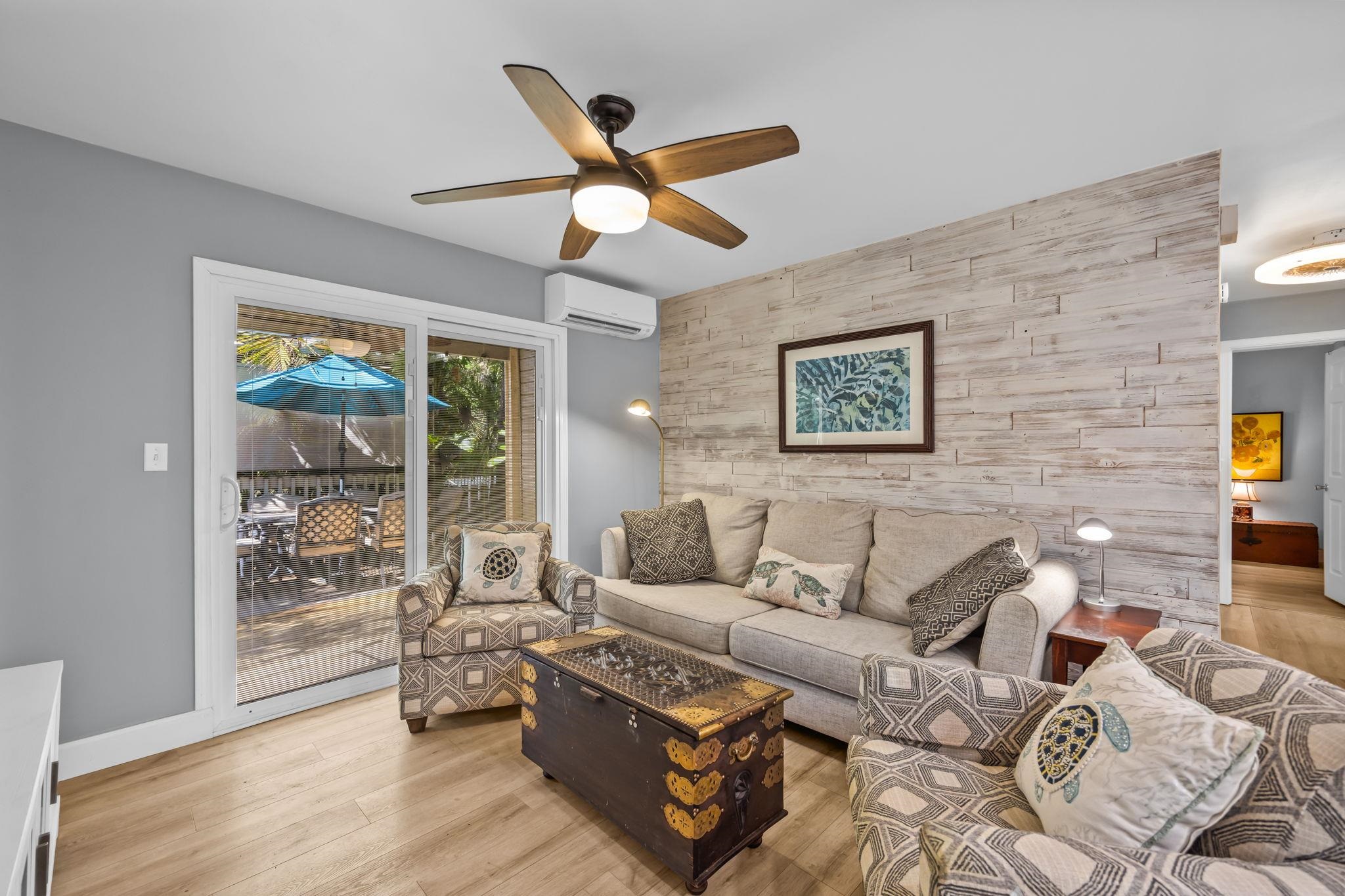 140 Uwapo Road, Unit 36104 Kihei, HI 96753 - Photo 2 of 33 a living room with furniture and a large window