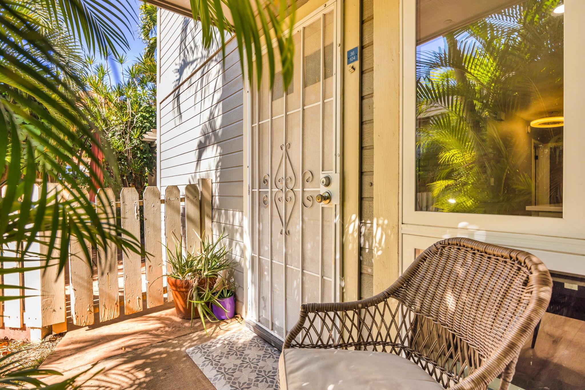 140 Uwapo Road, Unit 36104 Kihei, HI 96753 - Photo 30 of 33 a view of a door with a chair and the potted plants