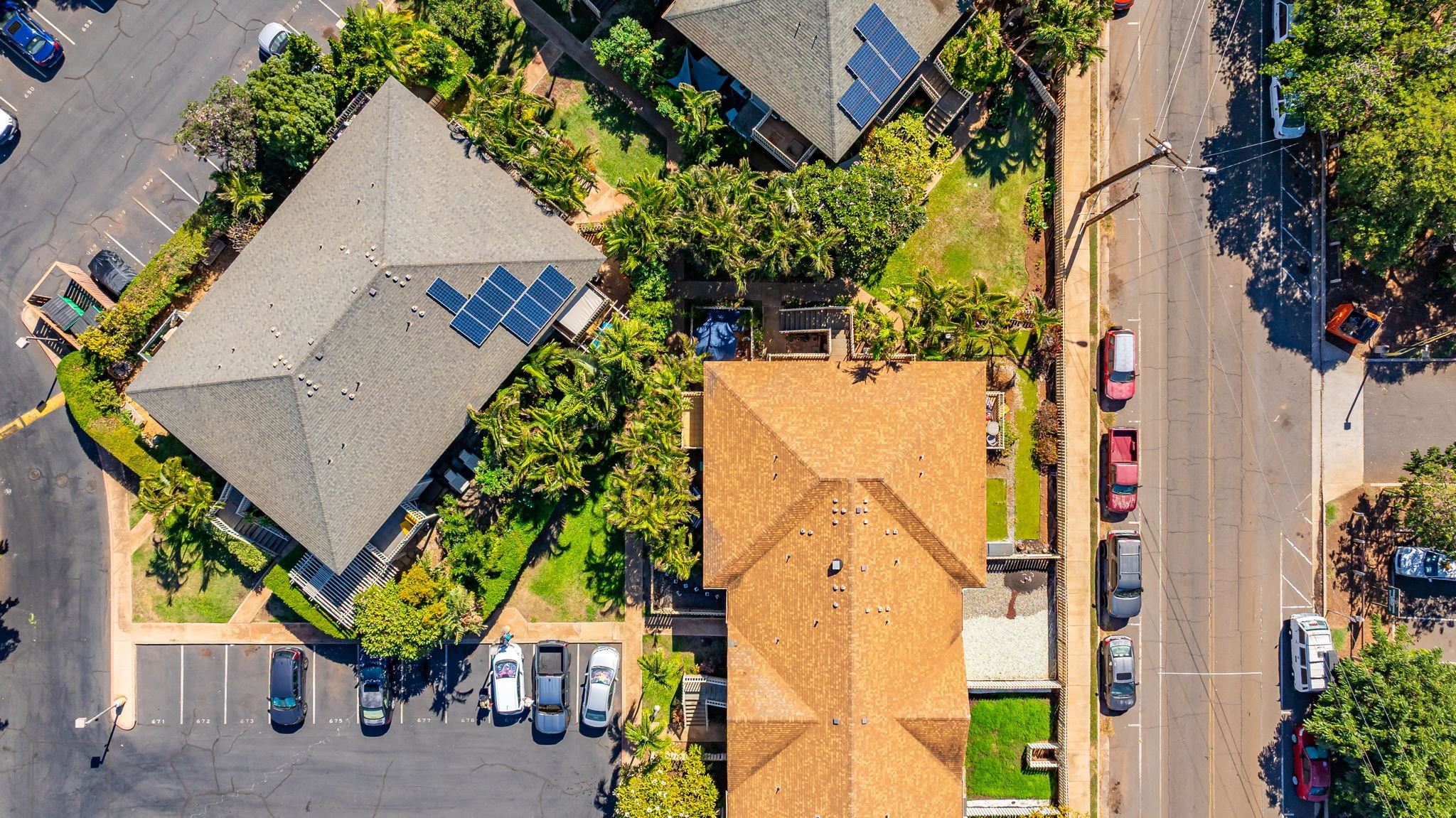 140 Uwapo Road, Unit 36104 Kihei, HI 96753 - Photo 31 of 33 an aerial view of a house with a yard and potted plants