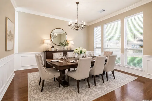 a view of a dining room with furniture window and wooden floor