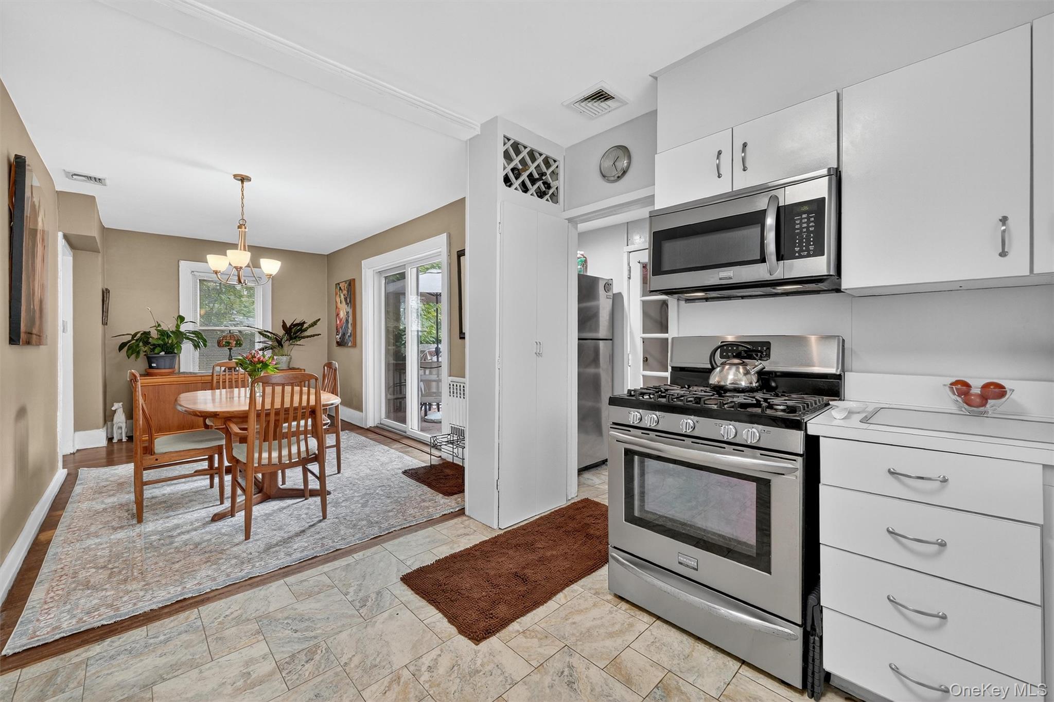 134 Dalmeny Road Briarcliff Manor, NY 10510 - Photo 17 of 44 a kitchen with stainless steel appliances granite countertop a stove a sink and a refrigerator