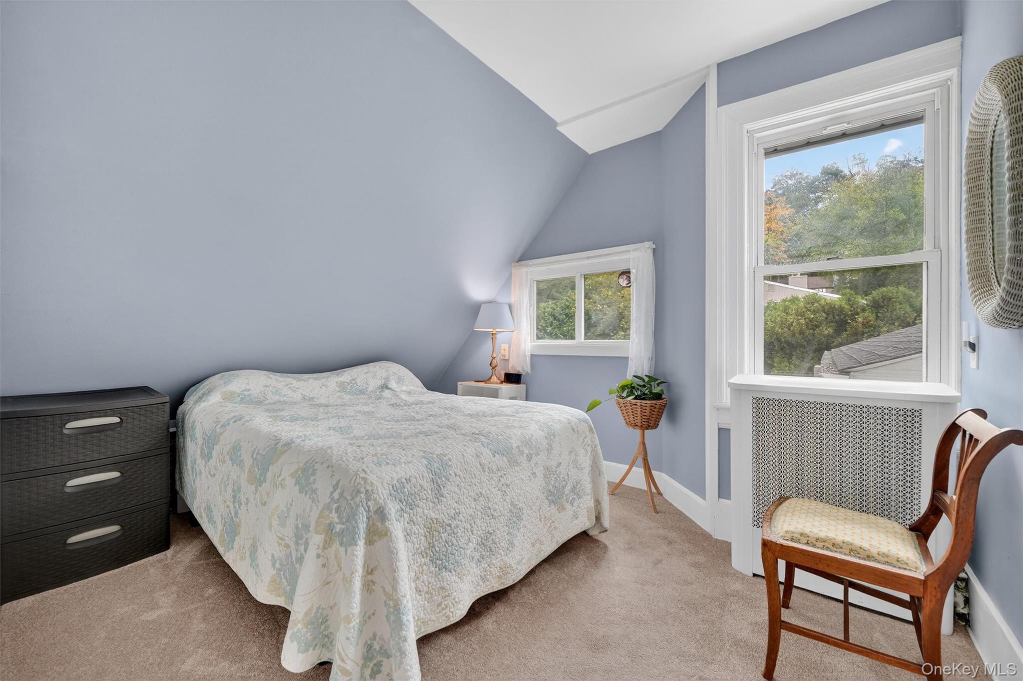 134 Dalmeny Road Briarcliff Manor, NY 10510 - Photo 20 of 44 a bedroom with a bed and wooden floor