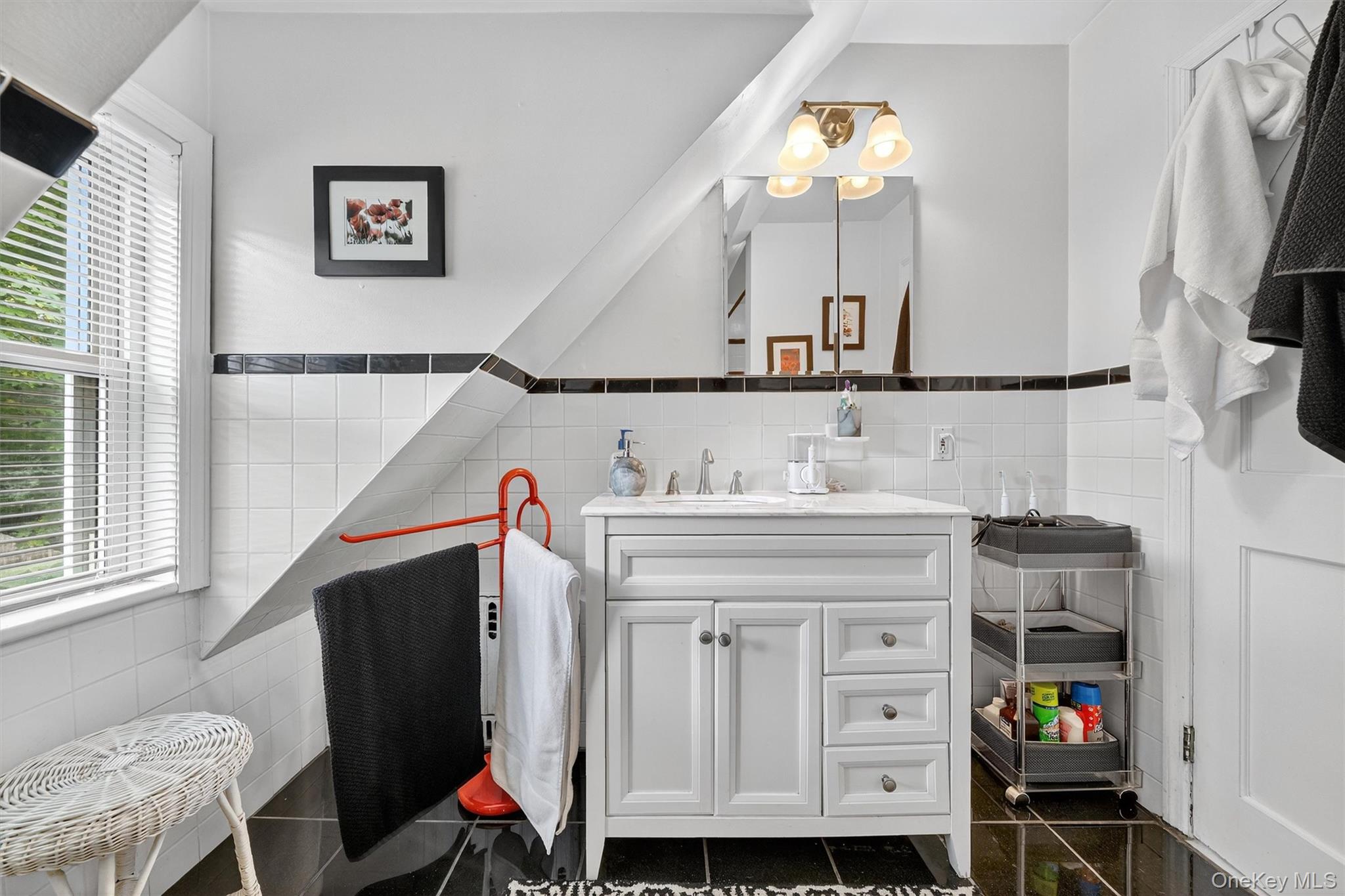 134 Dalmeny Road Briarcliff Manor, NY 10510 - Photo 23 of 44 a bathroom with a sink and a mirror