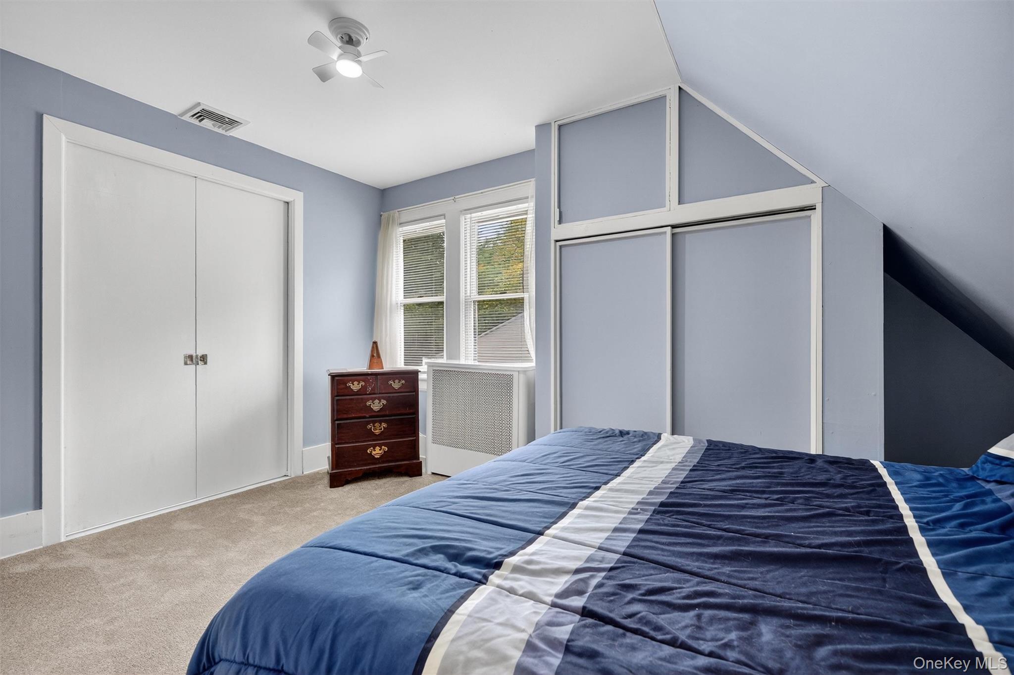 134 Dalmeny Road Briarcliff Manor, NY 10510 - Photo 29 of 44 a bedroom with a bed and wooden floor