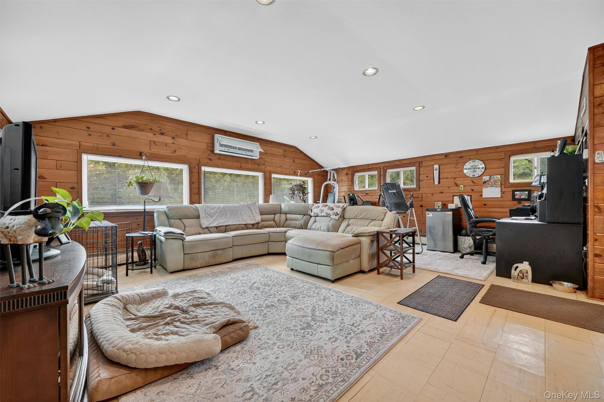 134 Dalmeny Road Briarcliff Manor, NY 10510 - Photo 32 of 44 a living room with furniture wooden floor and a large window